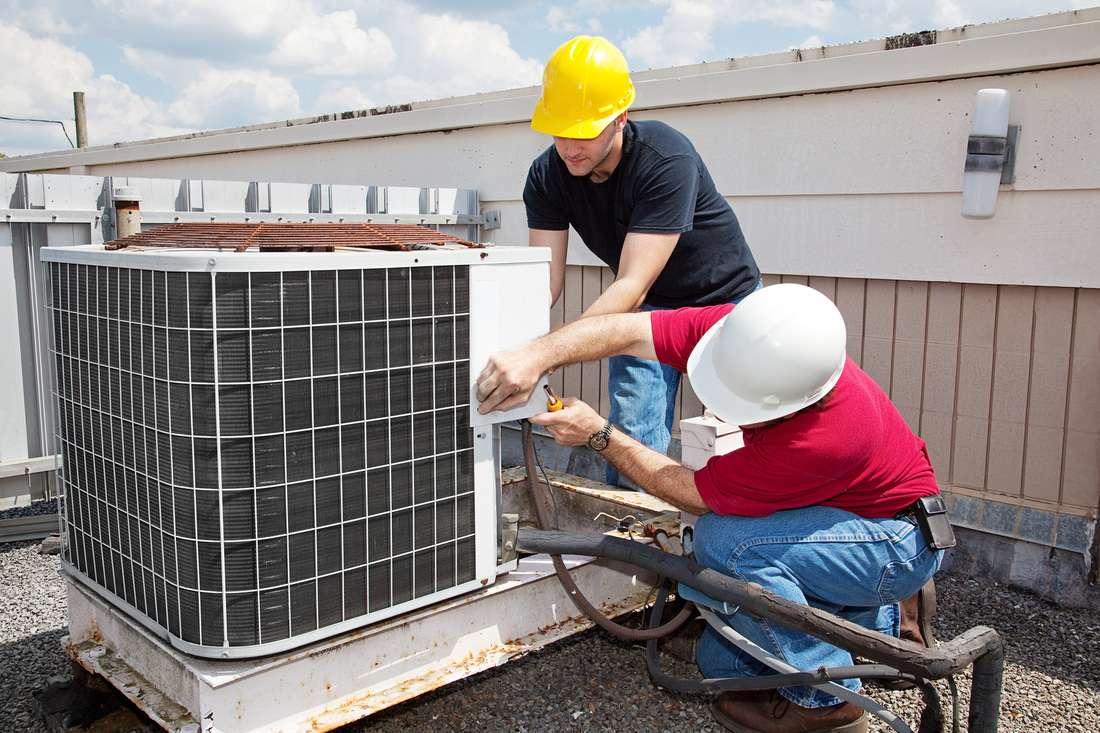 ATS - HVAC - men working on rooftop unit